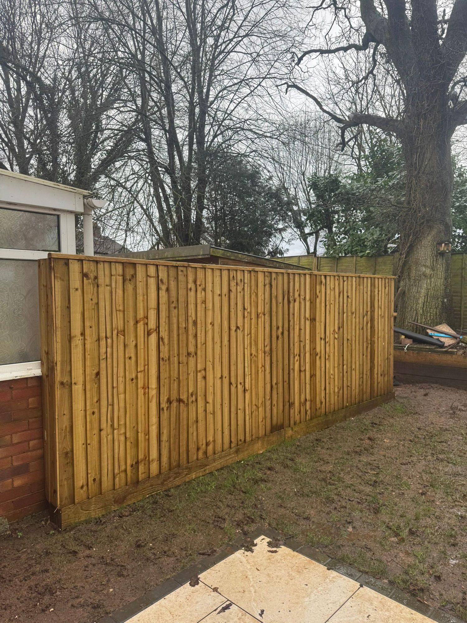 New close board timber fence installed along a rear garden boundary